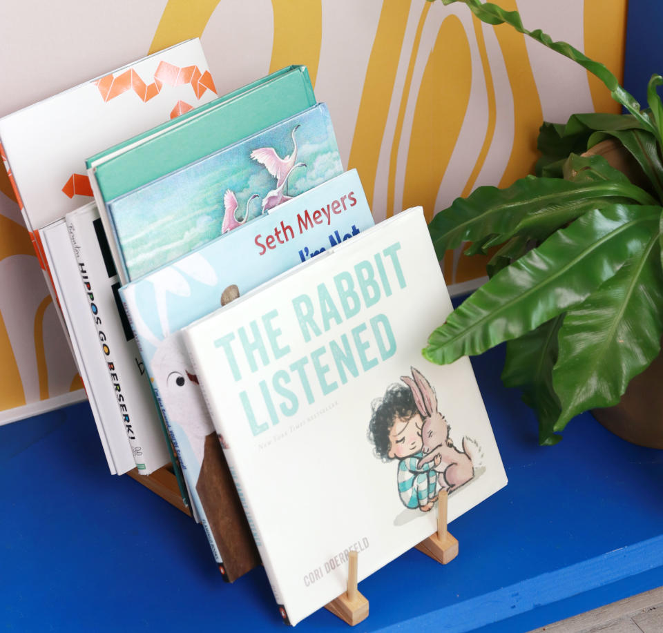 Use a dishrack to hold children's books to keep them in sight and within reach!