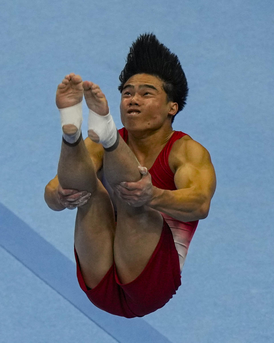 Asher Hong competes in the floor exercise at the United States Gymnastics Olympic Trials on Thursday, June 27, 2024, in Minneapolis. (AP Photo/Charlie Riedel)