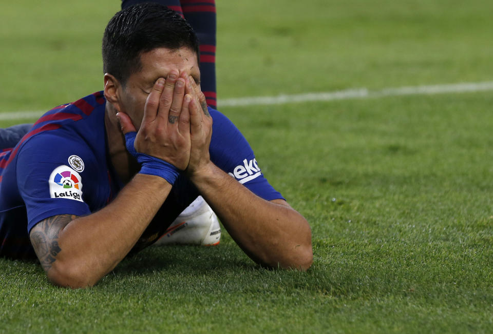 Barcelona forward Luis Suarez celebrates after scoring his side's third goal during the Spanish La Liga soccer match between FC Barcelona and Real Madrid at the Camp Nou stadium in Barcelona, Spain, Sunday, Oct. 28, 2018. (AP Photo/Joan Monfort)