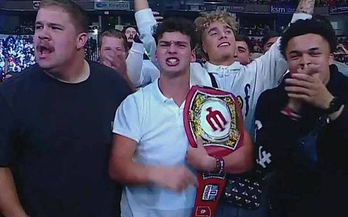 Declan McMahon, sporting a WWE style IU championship belt, with some of his Indiana University football teammates during a WWE show.