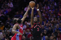 Toronto Raptors' O.G. Anunoby (3) goes up to shoot against Philadelphia 76ers' James Harden during the first half of an NBA basketball game, Friday, March 31, 2023, in Philadelphia. (AP Photo/Matt Rourke)