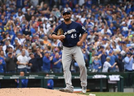 Oct 1, 2018; Chicago, IL, USA; Milwaukee Brewers starting pitcher Jhoulys Chacin (45) reacts after Chicago Cubs first baseman Anthony Rizzo (44, not pictured) hits a solo home run during the fifth inning in the National League Central division tiebreaker game at Wrigley Field. Mandatory Credit: Patrick Gorski-USA TODAY Sports