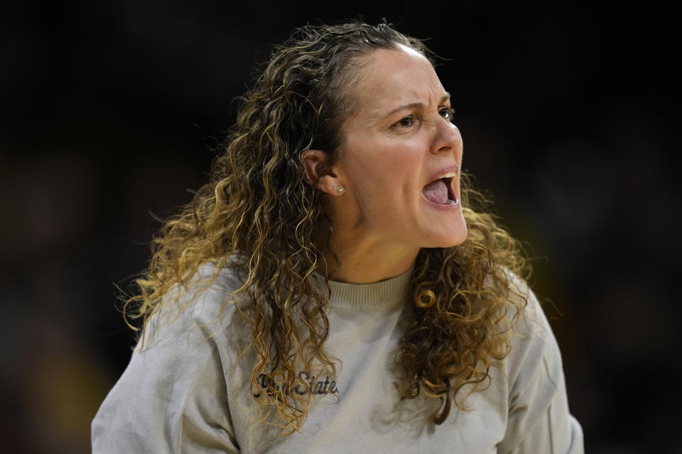 Penn State head coach Carolyn Kieger watches from the bench during the first half of an NCAA college basketball game against Iowa, Thursday, Feb. 8, 2024, in Iowa City, Iowa. (AP Photo/Charlie Neibergall)