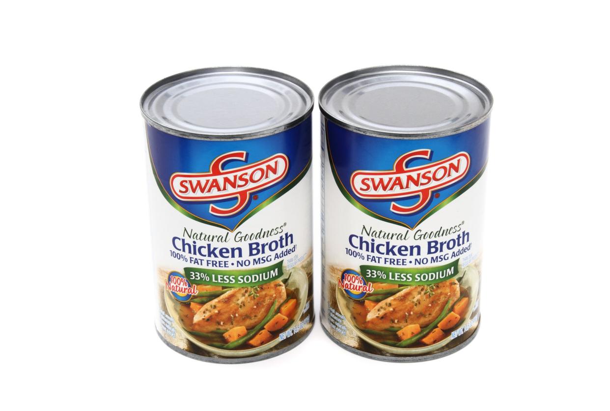 Product shot of two cans of Swanson Chicken Broth