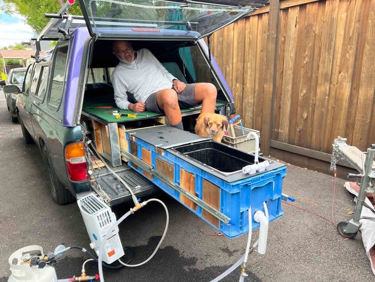 <span class="article__caption">My father, Charles Carter, and our family dog, Lola, admire our handiwork. (Photo: Victoria Carter)</span>