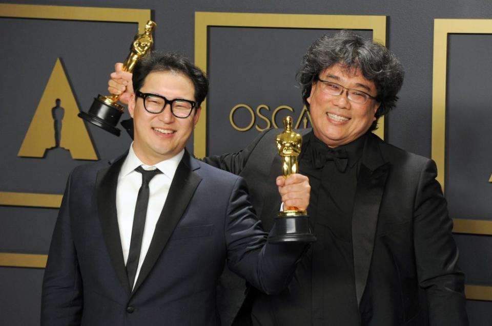 hollywood, ca   february 09  jin won han and bong joon ho pose with their awards for original screenplay parasite inside the press room of the 92nd annual academy awards held at hollywood and highland on february 9, 2020 in hollywood, california  photo by albert l ortegagetty images