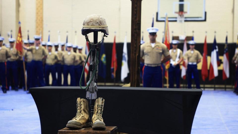 PHOTO: Military identification tags hang as veterans and gold star families of the 2nd Battalion, 4th Marines gather during a ceremony marking the 20th anniversary of the Battle of Ramadi at Camp Pendleton, California, April 5, 2024.  (David Swanson/AFP via Getty Images)