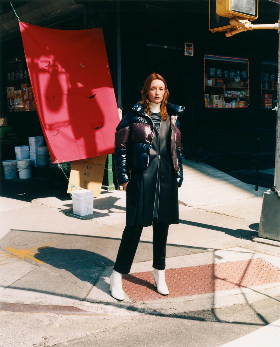 Audrey Marnay goes sleek and chic by throwing a Moncler jacket over her leather coat.