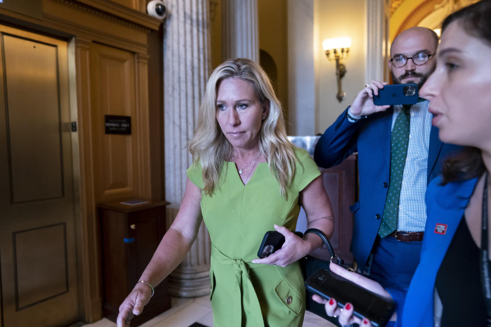 FILE - Rep. Marjorie Taylor Greene, R-Ga., departs the House chamber at the end of votes, at the Capitol in Washington, May 12, 2022. Greene is testing Republican voters' tolerance for controversy in the May 24, 2022, Republican primary. (AP Photo/J. Scott Applewhite, File)