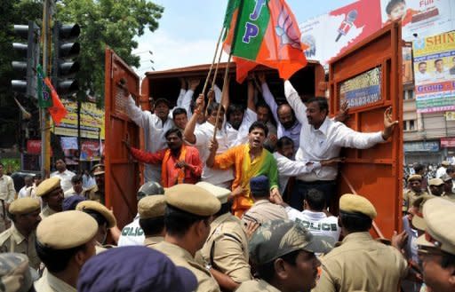 Indian police detain activists from the opposition Bharatiya Janata Party during protests in Hyderabad. Shopkeepers, traders and labourers in India blocked railway lines and closed markets to protest against reforms allowing in foreign retail giants such as Walmart and Tesco