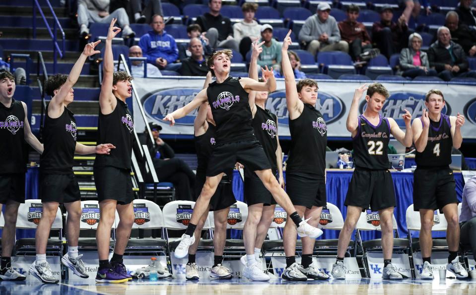 The Campbell County bench celebrates a three-point shot against Newport Thursday at the 2024 UK Healthcare KHSAA Boys' Sweet 16 in Lexington. March 21, 2024