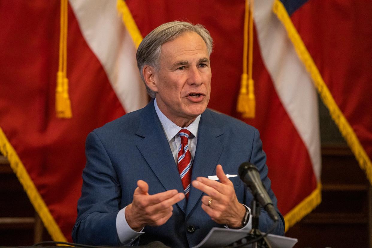 <p>Texas governor Greg Abbott, pictured at a pandemic press conference in May 2020, has vowed to pass a law punishing large cities for defunding the police</p> (Getty)