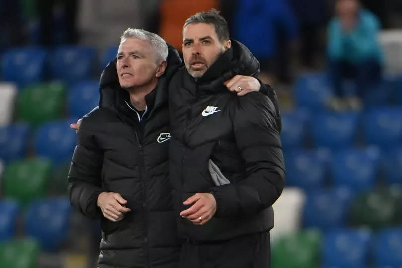 A picture of Larne manager Tiernan Lynch celebrating with his brother Seamus