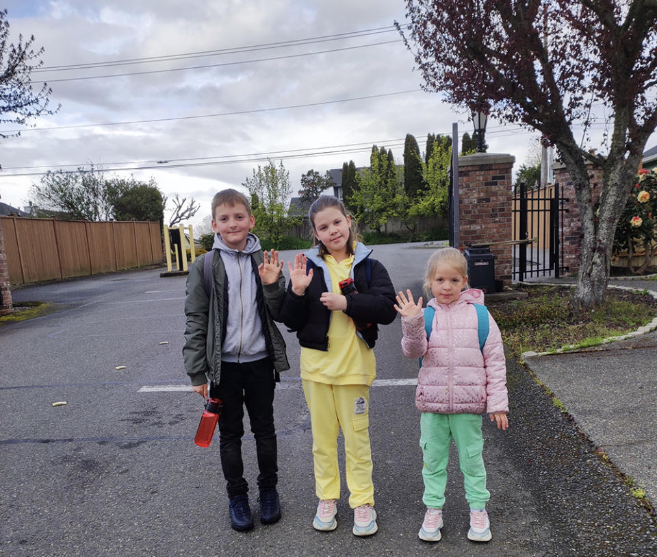 Illia Puzhalina, 10, and his two sisters, Yeva, 9, and Virsaviia, 6, head off to school on the morning of April 26. (Anastasiia Puzhalina)