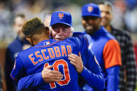 New York Mets manager Buck Showalter, right, hugs New York Mets' Eduardo Escobar after a baseball game against the Miami Marlins Wednesday, Sept. 28, 2022, in New York. The Mets won 5-4. (AP Photo/Frank Franklin II)