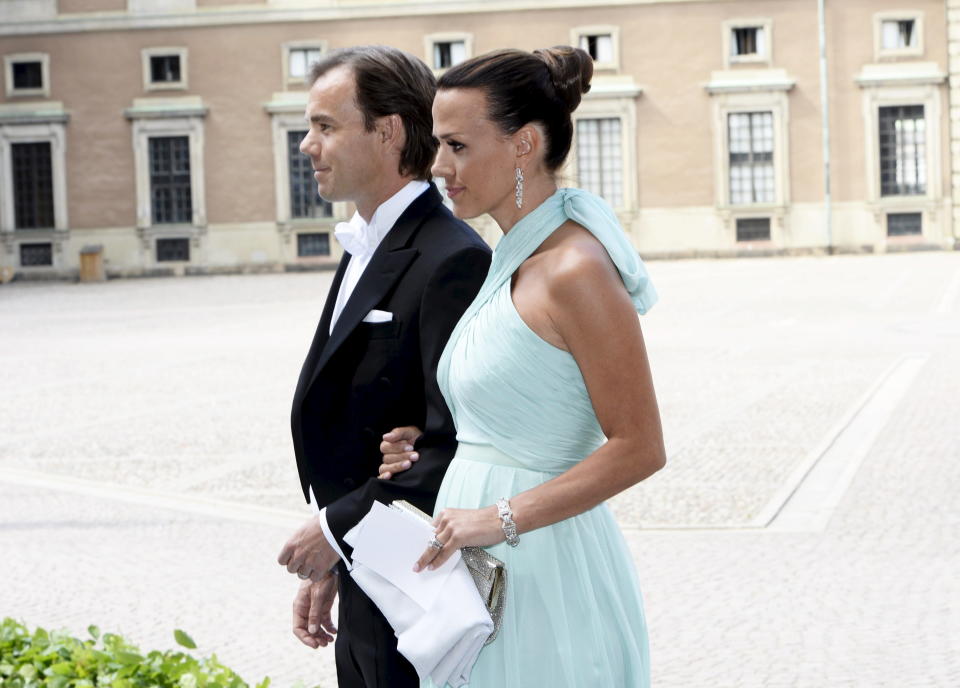 CEO of fashion company Hennes & Mauritz (H&M) Karl-Johan Persson and wife Leonie arrive for the wedding of Swedish Princess Madeleine and Christopher O'Neill at the Royal Castle in Stockholm, Saturday June 8, 2013. (AP Photo/Maja Suslin, Scanpix) SWEDEN OUT