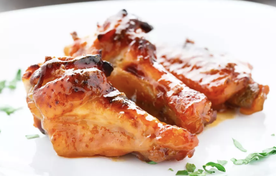 <p>You really can’t go wrong with chicken wings coated in a spicy honey and garlic sauce. Need we say more? </p> <p><a href="https://www.thedailymeal.com/best-recipes/honey-garlic-chicken-wings-crockpot?referrer=yahoo&category=beauty_food&include_utm=1&utm_medium=referral&utm_source=yahoo&utm_campaign=feed" rel="nofollow noopener" target="_blank" data-ylk="slk:For the Honey Garlic Chicken Wings recipe, click here.;elm:context_link;itc:0;sec:content-canvas" class="link ">For the Honey Garlic Chicken Wings recipe, click here. </a></p>