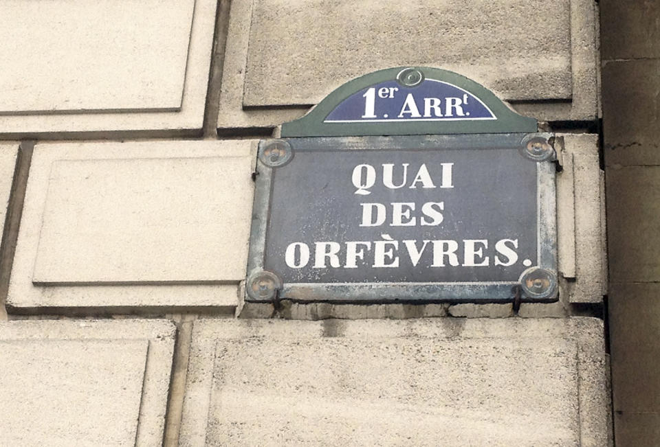 FILE - This Friday, Feb. 6, 2015 file picture shows a street sign at the 36 Quai des Orfevres police headquarters in Paris, France. Two anti-gang French policemen are going on trial over charges of gang-raping a Canadian tourist at Paris police headquarters. (AP Photo/Francois Mori, File)