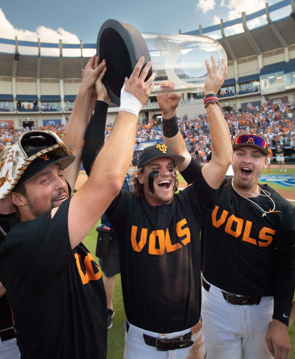 May 29 in Hoover, Alabama: Tennessee players Luc Lipcius (40), Cortland Lawson (9) and Blake Burke (25) celebrate their SEC tournament championship win over Florida. Mandatory Credit: Gary Cosby Jr./The Tuscaloosa News