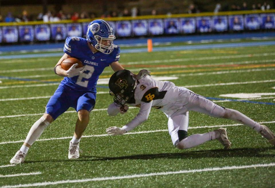 Caldwell's Harry Boland tries to elude Hanover Park's Dominic Madera during the first half of the North 1, Group 2 football final at Caldwell High School on November 19, 2021.  Alexandra Pais/ for the Daily Record