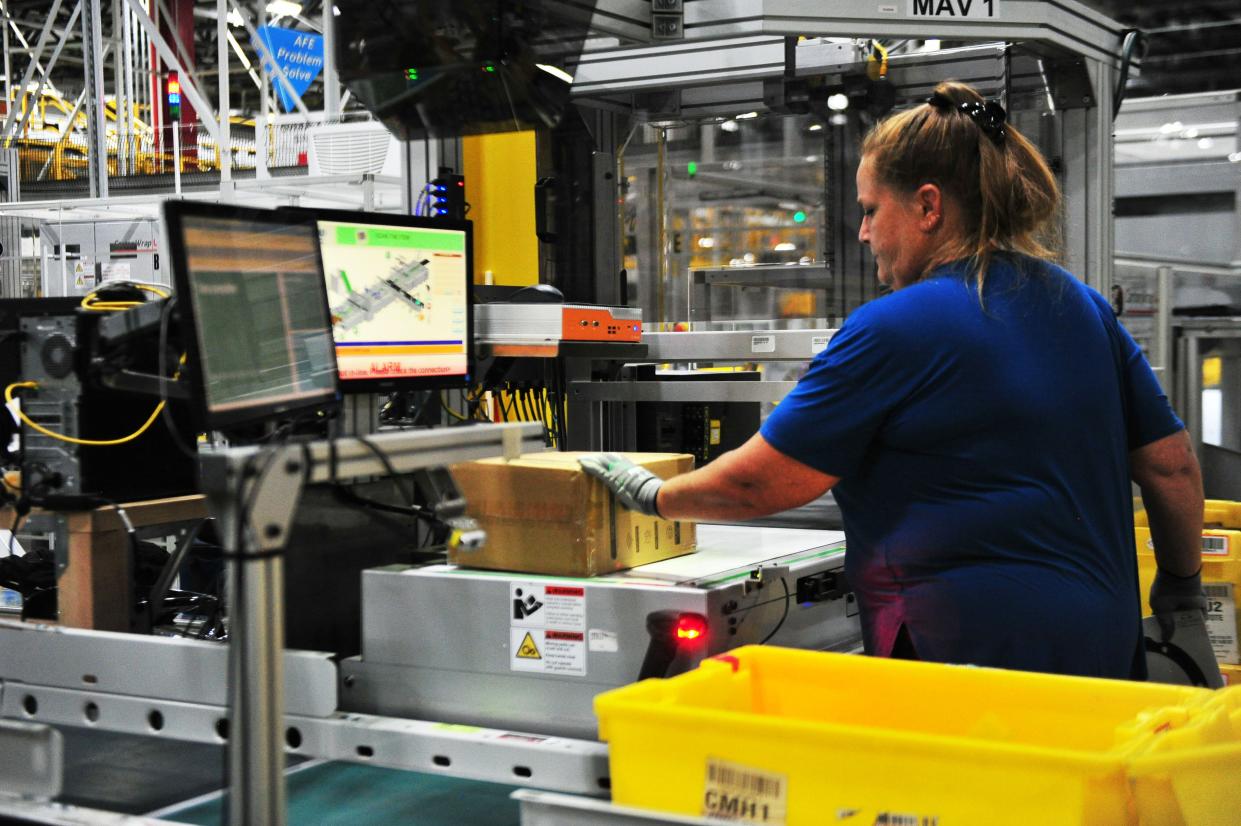 Amazon employee Faye Murphy scans items to be boxed at the new Maryville Amazon facility on Thursday Oct. 5, 2023.