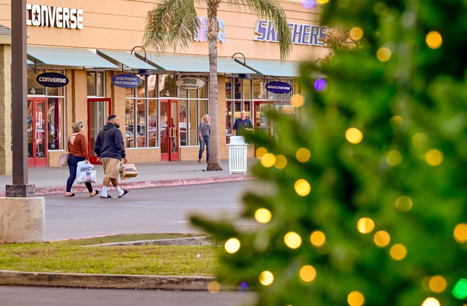 Decorations for holiday shoppers are out at Tulare Outlets on Friday, November 18, 2022. 