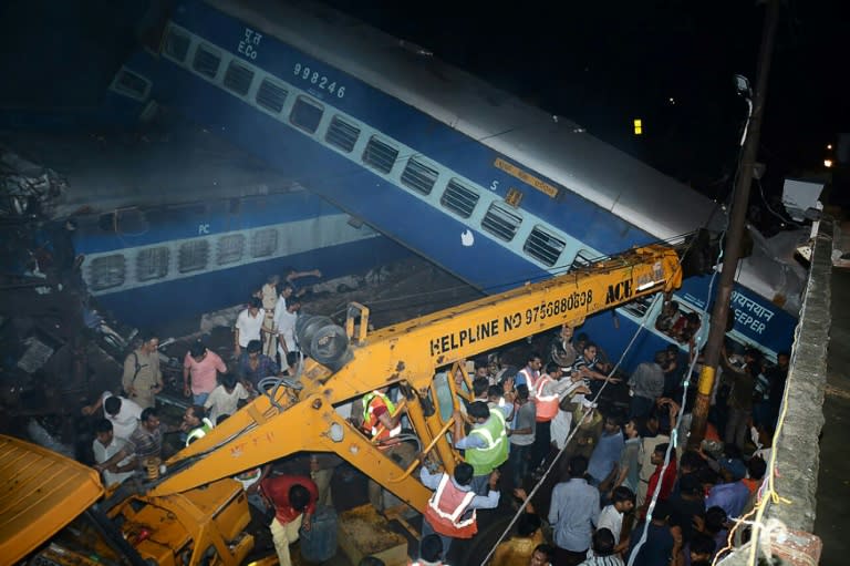 Emergency workers seek survivors of the derailment