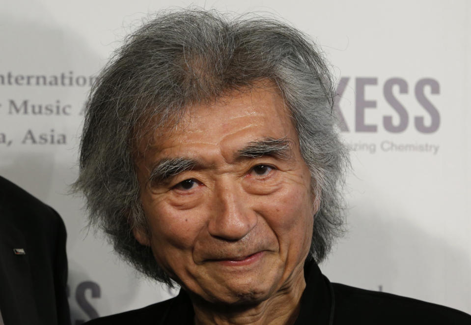 FILE - Former Boston Symphony conductor Seiji Ozawa poses for photographers during a press conference in Tokyo on April 3, 2013. World-renowned conductor Ozawa has died of heart failure at his home in Tokyo, his management office said Friday, Feb. 9, 2024. He was 88. (AP Photo/Shizuo Kambayashi, File)