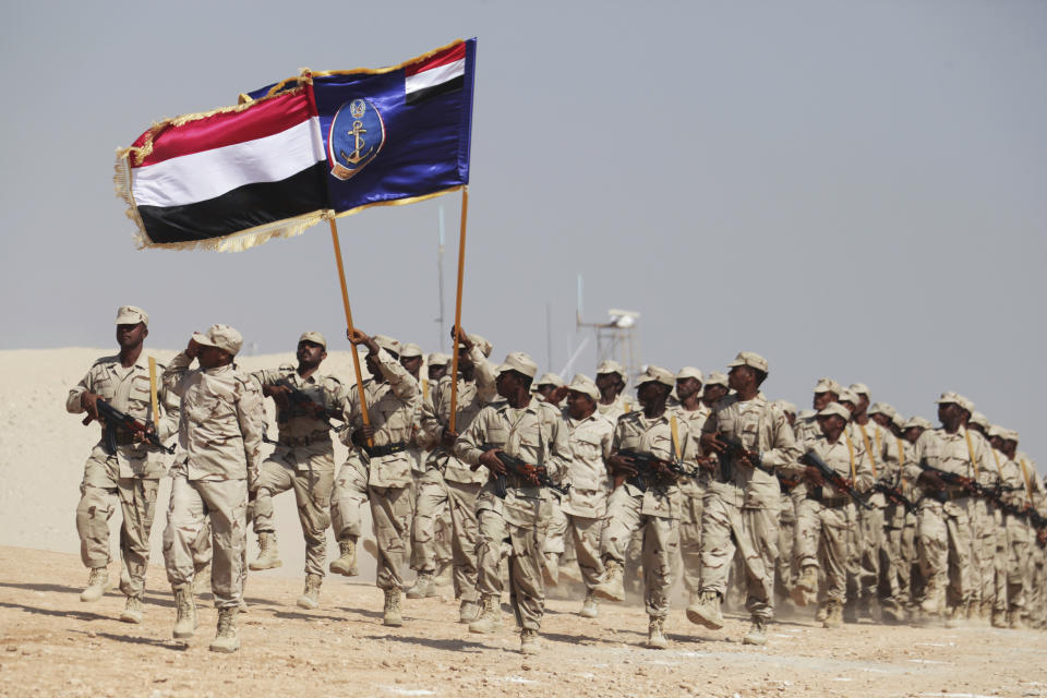 File - In this Thursday, Nov. 29, 2018 file photo, Yemeni solders march during a military ceremony in Mukalla, Yemen. The United Arab Emirates, one of the most powerful parties in Yemen’s war, has begun to draw down its forces in past weeks in 2019, leaving the Saudi-led coalition with a weakened ground presence and fewer tactical options. The withdrawal of several thousand troops comes amid heightened tensions between the United States and Iran, and as the Iranian-allied Yemeni rebels known as Houthis increase their attacks on Saudi Arabia. (AP Photo/Jon Gambrell, File)