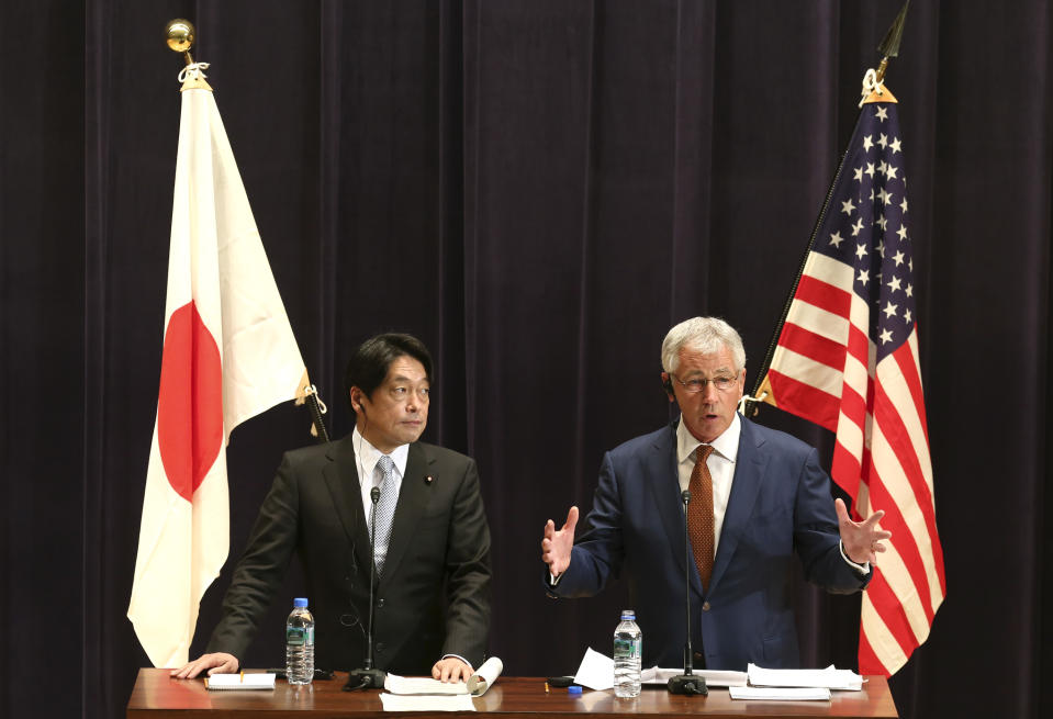 U.S. Secretary of Defense Chuck Hagel, right, answers a question from a journalist as his Japanese counterpart Itsunori Onodera listens during their joint press conference in Tokyo, Sunday, April 6, 2014. The U.S. will deploy two additional ballistic missile defense destroyers to Japan by 2017 as part of an effort to bolster protection from North Korean missile threats, Hagel said Sunday. (AP Photo/Eugene Hoshiko)