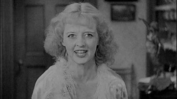 Bette Davis as Mildred Rogers yelling at the camera in Of Human Bondage.