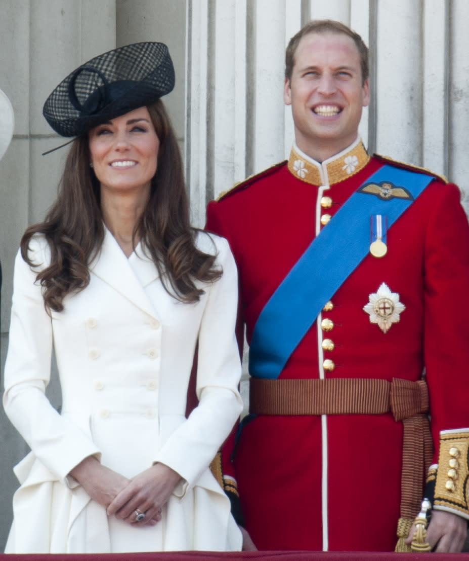 <p>Kate opted for another Alexander McQueen look for the Trooping The Colour. Dressed in a white ruffled coat, Kate accessorised with a chic black hat. </p><p><i>[Photo: PA]</i></p>