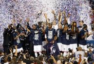 Apr 7, 2014; Arlington, TX, USA; The Connecticut Huskies celebrate winning the championship game of the Final Four in the 2014 NCAA Mens Division I Championship tournament over the Kentucky Wildcats at AT&T Stadium. Kevin Jairaj-USA TODAY Sports