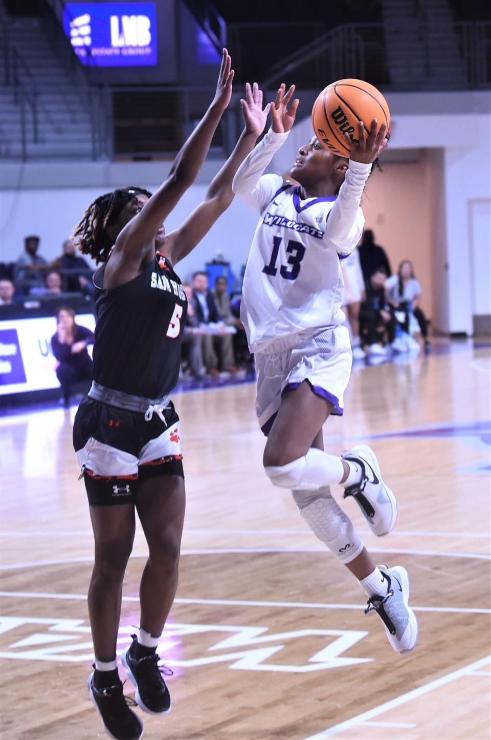 ACU's Zoe Jackson, right, shoots over Sam Houston's Chyna Allen in the first half.