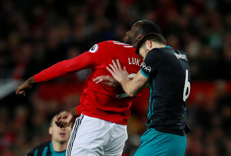 Soccer Football - Premier League - Manchester United vs Southampton - Old Trafford, Manchester, Britain - December 30, 2017 Manchester United's Romelu Lukaku sustains an injury after this challenge from Southampton's Wesley Hoedt Action Images via Reuters/Jason Cairnduff