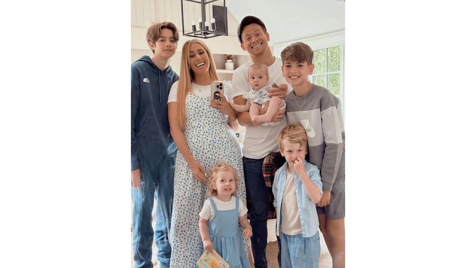 Stacey in selfie with Joe and five kids