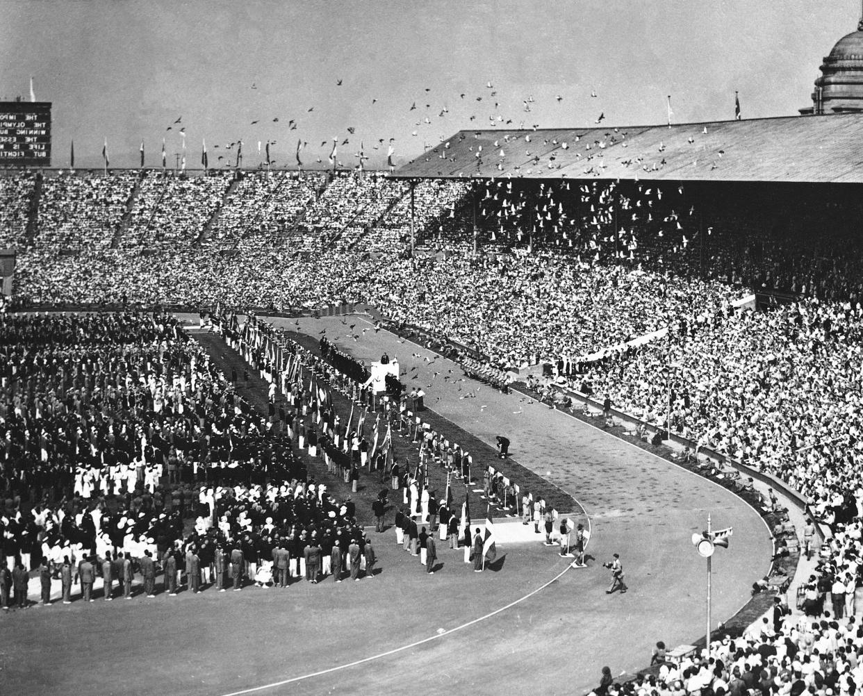 After His Majesty the King declared the 1948 Olympic Games opened, seven thousand pigeons were released, July 29, 1948, at Wembley Stadium in London. In the times of the Ancient Games, the pigeons were used as a signal to warn the Greeks that the Games had begun. (AP Photo/Press Association)