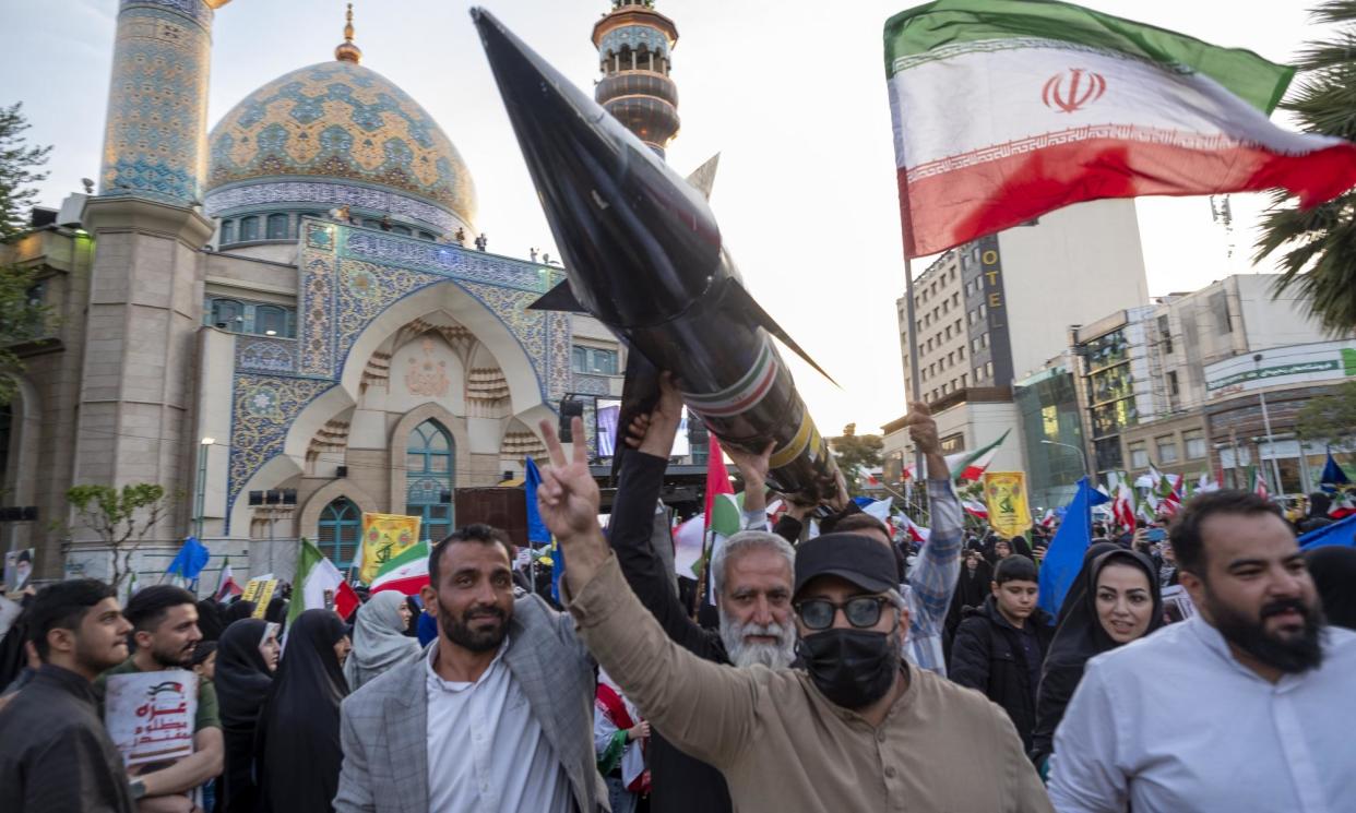 <span>A model of Iran's first-ever hypersonic missile, Fattah, is carried during a march in Tehran to celebrate the missile attack against Israel, 15 April 2024. </span><span>Photograph: Morteza Nikoubazl/NurPhoto/Rex/Shutterstock</span>