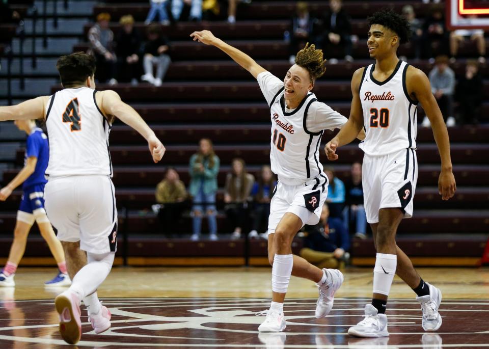 The Republic Tigers celebrate after beating the Hartville Eagles in overtime in a Blue Division semifinal game of the Blue & Gold Tournament at Great Southern Bank Arena on Wednesday, Dec. 28, 2022.