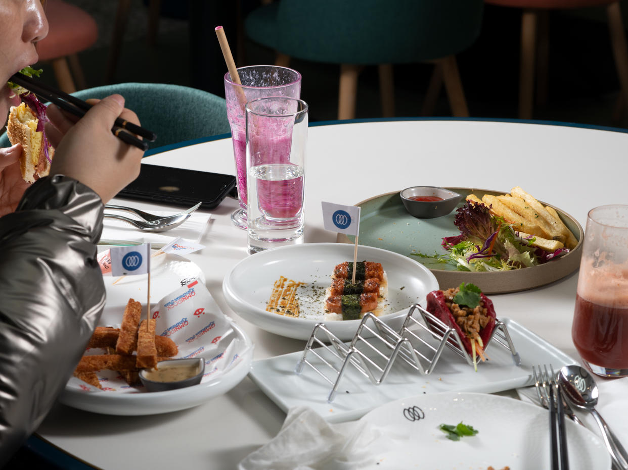 A customer tucks into a meat-free banquet at Green Common café in Shanghai on Jan. 13