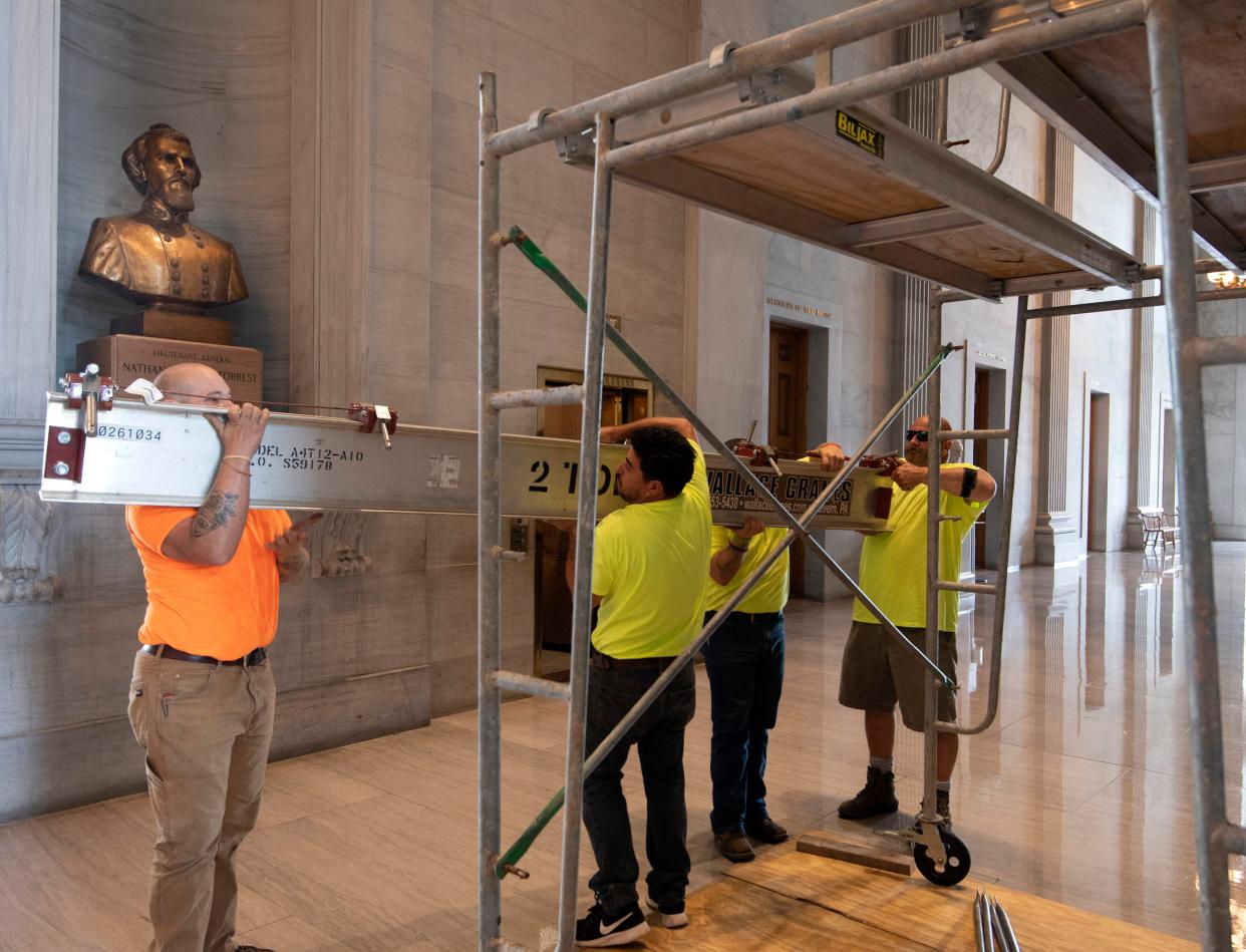 Workers prepare scaffolding in front of a bust of Confederate General and early Ku Klux Klan leader Nathan Bedford Forrest at the State Capitol Thursday, 22 July 2021 in Nashville, Tennessee.  (AP)