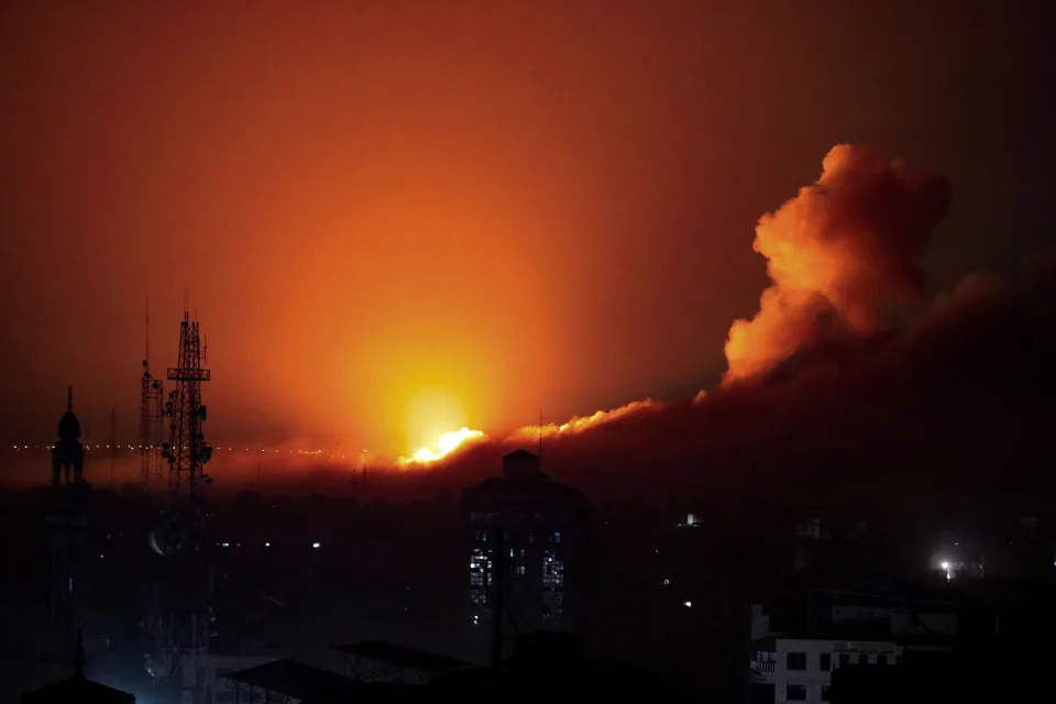 Smoke and flames rise during an Israeli air strike on west Gaza (REUTERS)