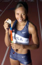 Allyson Felix of the United States poses with 2004 Athens Olympic Track & Field silver medal in the 200 meters. (Photo by Kirby Lee/WireImage)