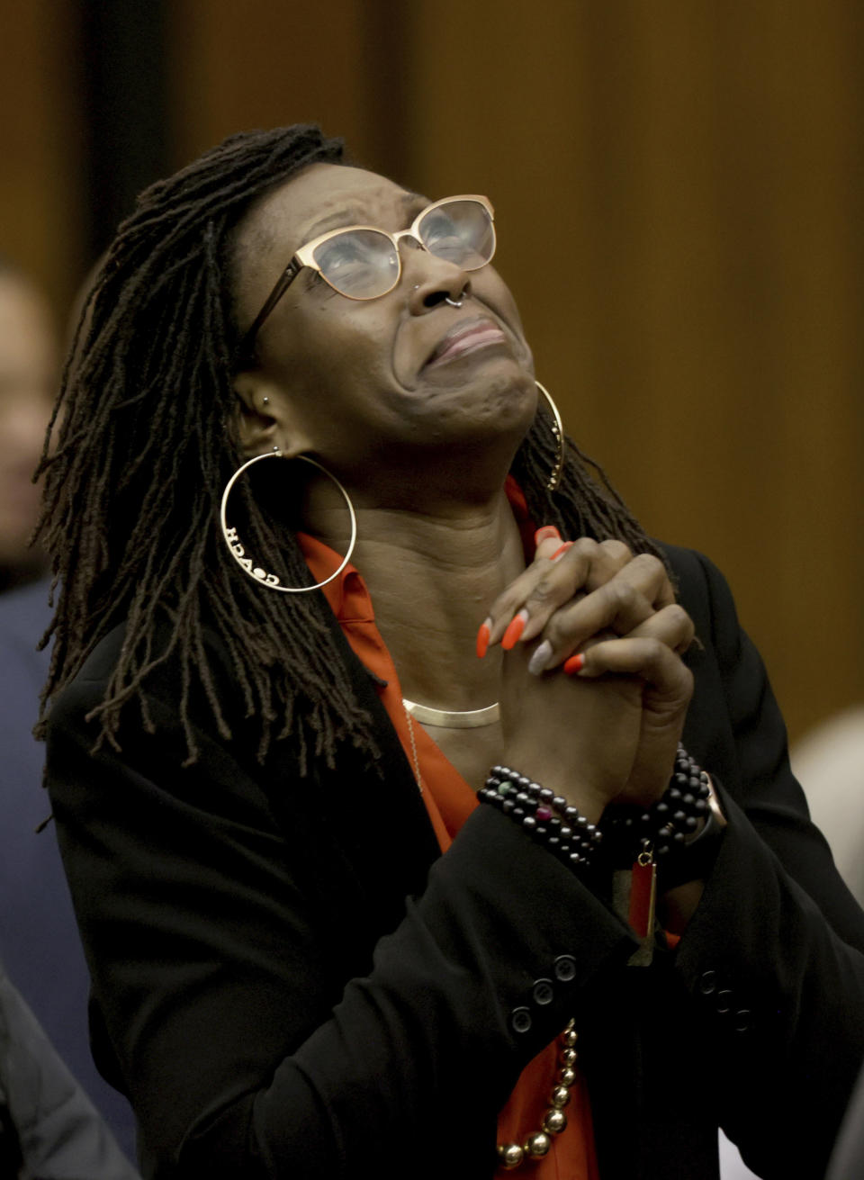 Erika Barrow, former girlfriend to Lamar Johnson, reacts on Tuesday, Feb. 14, 2023, after St. Louis Circuit Judge David Mason vacated his murder conviction during a hearing in St. Louis, Mo. Johnson served nearly 28 years of a life sentence for a killing that he has always said he didn't commit. (Christian Gooden/St. Louis Post-Dispatch via AP, Pool)