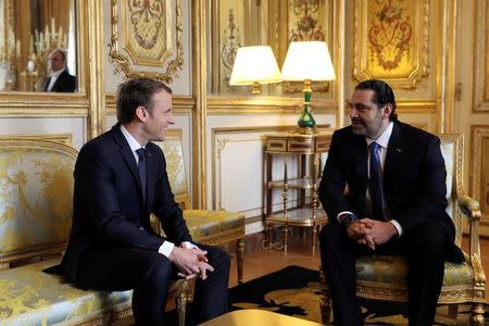 French President Emmanuel Macron and Saad al-Hariri, who announced his resignation as Lebanon's prime minister while on a visit to Saudi Arabia, meet for talks at the Elysee Palace in Paris, France, November 18, 2017. REUTERS/Stringer