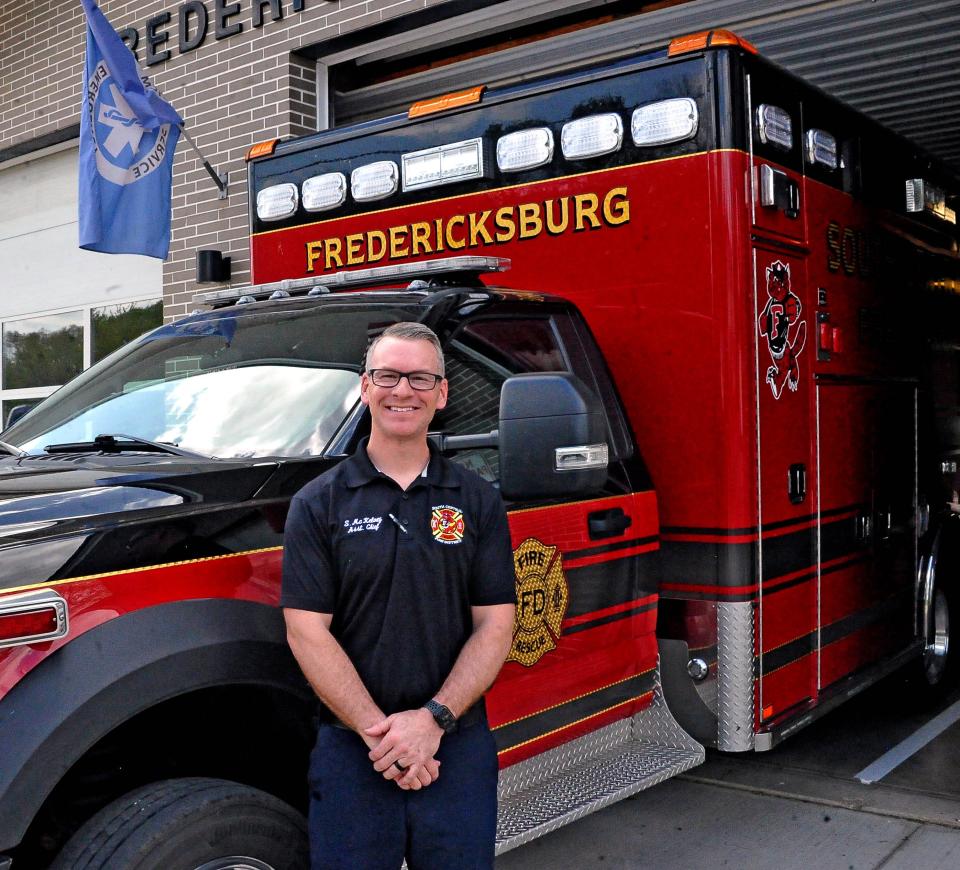 Shawn McKelvey stands in front of the Fredericsksburg Fire Department squad. McKelvey, assistant chief, was recently named Fire Officer of the Year by the Ohio Department of Commerce's Division of State Fire Marshal and Ohio Department of Public Safety's Division of EMS.