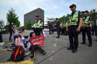 One of Park's supporters cried outside the court, before what prosecutors said would be 'the trial of the century'