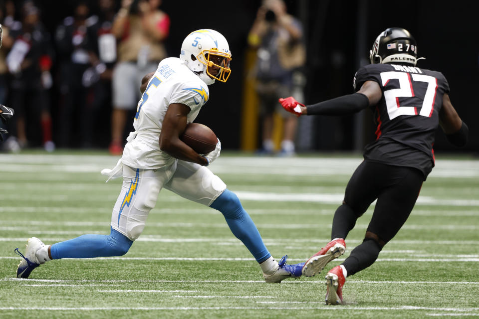 CORRECTS DATE TO SUNDAY, NOV. 6 INSTEAD OF TUESDAY, DEC. 6 - Los Angeles Chargers wide receiver Joshua Palmer (5) run from Atlanta Falcons safety Richie Grant (27) after catching a pass during the first half of an NFL football game, Sunday, Nov. 6, 2022, in Atlanta. (AP Photo/Butch Dill)