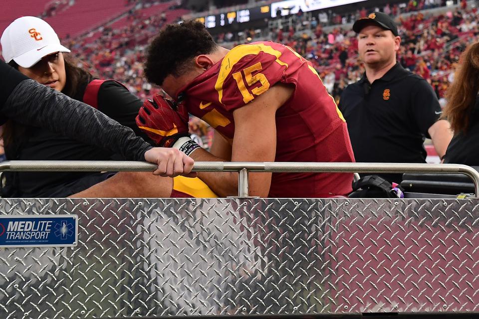 Drake London reacts after suffering an ankle injury on a touchdown catch against Arizona at the Coliseum on Oct. 30.