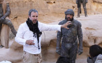 This image released by Warner Bros. Pictures shows director Denis Villeneuve, left, and actor Javier Bardem on the set of "Dune." (Chia Bella James/Warner Bros. Pictures via AP)